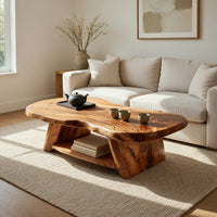 Figured wood free form coffee table with a lower shelf in a bright modern living room