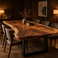 Long wood tabletop with uneven natural edges and bold swirling grain in an evening dining room with walnut wall paneling