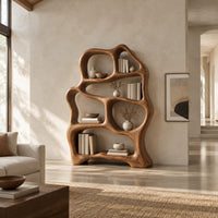 Free form wooden bookshelf with soft flowing open shelves in a bright open plan living room