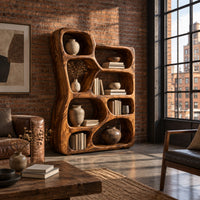 Freeform wooden bookshelf with irregular open cubbies of different sizes in an industrial loft living room with exposed brick