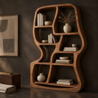 Corner detail of freeform wooden bookshelf with uneven open cubbies and a soft outline beside wood, brass and linen samples