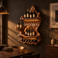 Freeform carved wine holder with a peaked top and a scalloped lower row in a dark dining room at golden hour