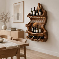 Freeform carved wine holder with a peaked top and a scalloped lower row in a Scandinavian dining room with white walls