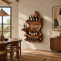 Freeform carved wine holder with a peaked top and a scalloped lower row in a bright open plan dining room