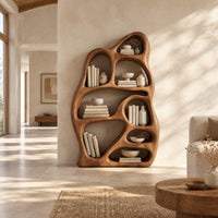 Freeform bookshelf with irregular openings in a sculpted organic frame in a bright open plan living room
