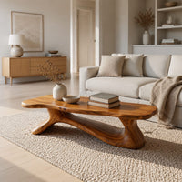 Freeform wooden coffee table with a sculpted branching base in a Scandinavian living room with white walls