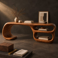 Corner detail of freeform loop desk with a swooping end and stacked oval shelves beside wood, brass and linen samples