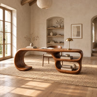 Freeform loop desk with a swooping end and stacked oval shelves in a bright open plan home office