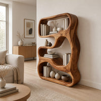 Freeform sculpted bookshelf with flowing open compartments in a thick wood frame in a Scandinavian living room with white walls