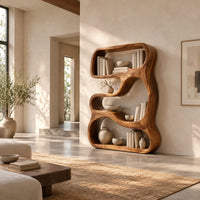 Freeform sculpted bookshelf with flowing open compartments in a thick wood frame in a bright open plan living room