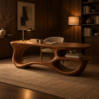 Freeform oval desk with an open loop base and a low shelf in an evening home office with walnut wall paneling