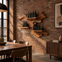 Organic wine rack with a gnarled outline, three shelves and a glass rail in an industrial loft dining room with exposed brick