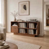 Low cabinet with a grid of open cubbies and a slim plinth base in a Scandinavian living room with white walls