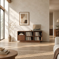 Low cabinet with a grid of open cubbies and a slim plinth base in a bright open plan living room