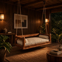 Hanging daybed swing with low wood rails and a thick seat pad in an evening porch with walnut wall paneling