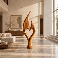 Flame sculpture with two pointed tips enclosing a heart shaped opening in a bright open plan living room