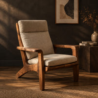 High back lounge chair with cushioned seat and sweeping wood arms, three-quarter view showing the grain