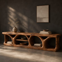 Long low media console with hollowed arch openings and open shelf bays, three-quarter view showing the grain