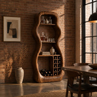 Freeform hourglass cabinet with open shelves and a grid of square cubbies in an industrial loft dining room with exposed brick