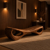 Hourglass bench with a narrow middle and hollow oval ends in an evening entryway with walnut wall paneling