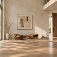 Hourglass bench with a narrow middle and hollow oval ends in a bright open plan entryway