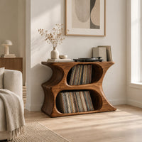 Hourglass record player stand with two stacked oval openings and a flat top in a Scandinavian living room with white walls