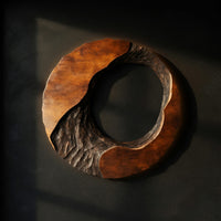 Chiseled and Burnished, a Round Wall Sculpture in Wood — view 1