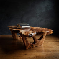 Hollow-Carved Pedestals Under a Free-Form Coffee Table