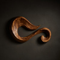 One Length of Walnut, Curled Into a Wall Sculpture — view 1
