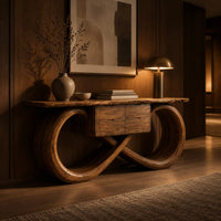 Console table with an infinity loop base and small center box in an evening entryway with walnut wall paneling