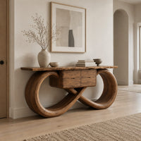 Console table with an infinity loop base and small center box in a Scandinavian entryway with white walls