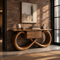 Console table with an infinity loop base and small center box in an industrial loft entryway with exposed brick