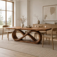 Dining table with a thick slab top on an infinity loop base in a Scandinavian dining room with white walls
