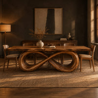 Rectangular dining table with a live edge top on a looped infinity base in a dark dining room at golden hour