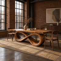 Rectangular dining table with a live edge top on a looped infinity base in an industrial loft dining room with exposed brick