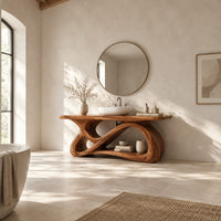 Bathroom vanity with a looping figure eight base and open shelf in a bright open plan bathroom