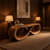 Low bench with a flat top and a hollow figure eight loop base in an evening entryway with walnut wall paneling