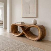 Low bench with a flat top and a hollow figure eight loop base in a Scandinavian entryway with white walls
