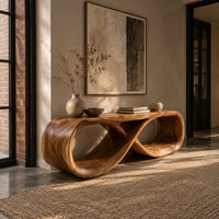Low bench with a flat top and a hollow figure eight loop base in an industrial loft entryway with exposed brick