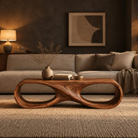 Coffee table shaped as an infinity loop with two oval openings in a dark living room at golden hour