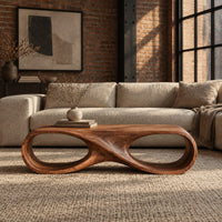 Coffee table shaped as an infinity loop with two oval openings in an industrial loft living room with exposed brick