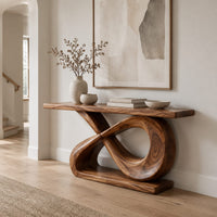 Console table with a hollow figure eight base and a long plank top in a Scandinavian entryway with white walls