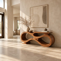 Console table shaped as an infinity loop with open ribbon spaces in a bright open plan entryway