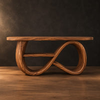 Console table with a figure eight ribbon base and a middle shelf in a dark studio against a charcoal plaster wall