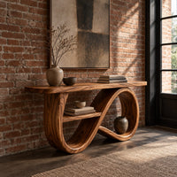 Console table with a figure eight ribbon base and a middle shelf in an industrial loft entryway with exposed brick