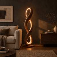 Twisted infinity loop floor lamp with a glowing inner edge in a dark living room at golden hour