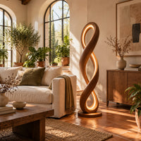 Twisted infinity loop floor lamp with a glowing inner edge in a bright living room with arched windows and plants