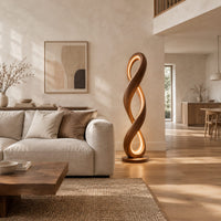 Twisted infinity loop floor lamp with a glowing inner edge in a bright open plan living room