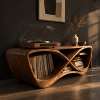 Infinity shaped record console with open bays and a smooth sculpted body, three-quarter view showing the grain