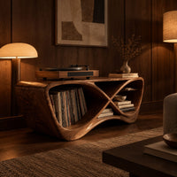 Infinity shaped record console with open bays and a smooth sculpted body in an evening living room with walnut wall paneling